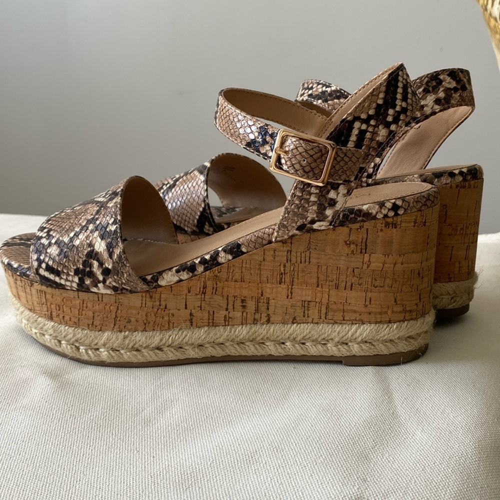Snake print platform sandal with cork and rope detailing on heel.